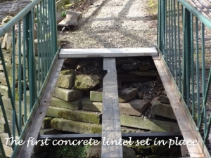 The first concrete lintel in place.